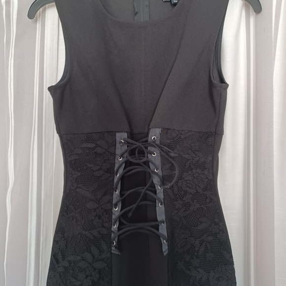 Black mini that laces up in front. - Picture 2 of 3